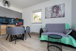 a living room with a couch and a table at Apartment Kristina by EL-PI Tours in Županje