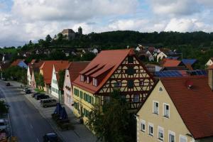 a view of a town with houses and a street at Gasthaus Schwarzer Adler in Colmberg