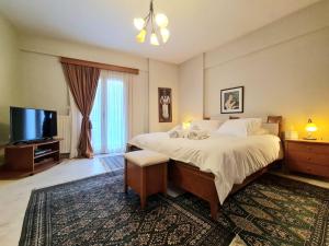 Ένα ή περισσότερα κρεβάτια σε δωμάτιο στο Papastavrou Apartments