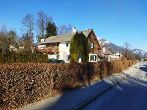 a house on the side of a road with a fence at Haus Tulpe in Strobl