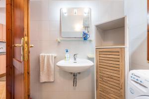 a small bathroom with a sink and a toilet at Maya in Villasimius +16 photos