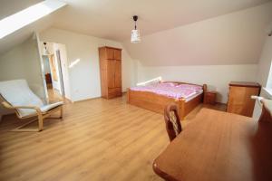 A bed or beds in a room at Apartmánový Dom River