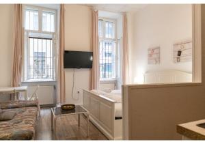Telewizja i/lub zestaw kina domowego w obiekcie Stylish Apt - Ideal for Longstays near Matzleinsdorferplatz