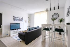 Televízia a/alebo spoločenská miestnosť v ubytovaní Cardo Apartments