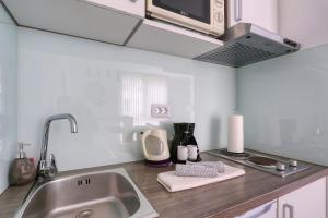 Kuchyňa alebo kuchynka v ubytovaní Cardo Apartments