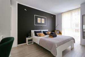 Posteľ alebo postele v izbe v ubytovaní Cardo Apartments