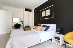 Posteľ alebo postele v izbe v ubytovaní Cardo Apartments