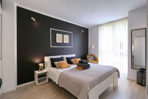 Posteľ alebo postele v izbe v ubytovaní Cardo Apartments