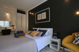 Posteľ alebo postele v izbe v ubytovaní Cardo Apartments