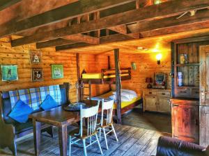 a bedroom with a dining table and a bunk bed at The Bothy in Newton Stewart