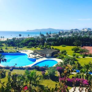 an aerial view of a resort with two swimming pools at Marina Smir Hotel & Spa in M'diq