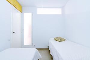 Postel nebo postele na pokoji v ubytování Beach Papa Luna Apartment