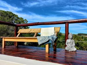 a bench on a deck with a towel on it at Marrakech Villa Serrana in Villa Serrana