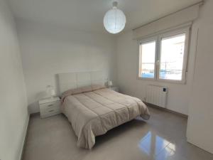 Postel nebo postele na pokoji v ubytování Beach Papa Luna Apartment