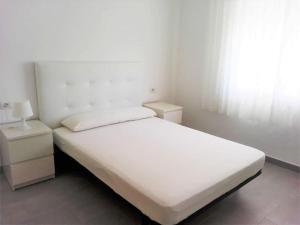 Postel nebo postele na pokoji v ubytování Beach Papa Luna Apartment
