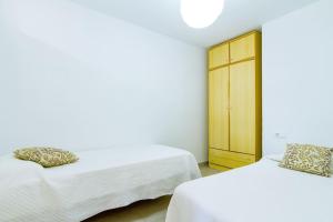 Postel nebo postele na pokoji v ubytování Beach Papa Luna Apartment