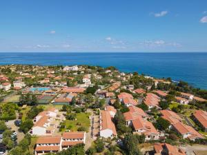 an aerial view of a residential neighborhood next to the ocean at Cefalu Resort - Sporting Club in Cefalù