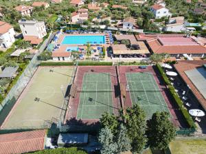 an overhead view of two tennis courts in a resort at Cefalu Resort - Sporting Club in Cefalù