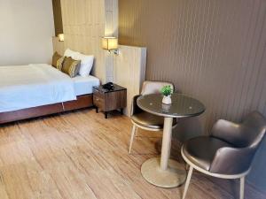 Postel nebo postele na pokoji v ubytování Manomon residence มโนมน เรสซิเดนซ์