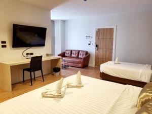 Postel nebo postele na pokoji v ubytování Manomon residence มโนมน เรสซิเดนซ์