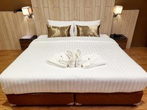 Postel nebo postele na pokoji v ubytování Manomon residence มโนมน เรสซิเดนซ์
