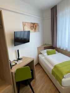 Postel nebo postele na pokoji v ubytování Hotel Garni Ilys Inn