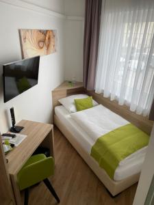 Postel nebo postele na pokoji v ubytování Hotel Garni Ilys Inn