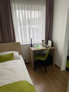Postel nebo postele na pokoji v ubytování Hotel Garni Ilys Inn
