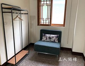 Postel nebo postele na pokoji v ubytování 沐光獨棟館