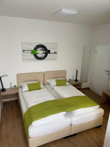 Postel nebo postele na pokoji v ubytování Hotel Garni Ilys Inn