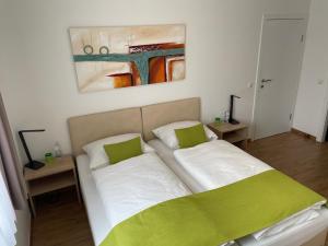 Postel nebo postele na pokoji v ubytování Hotel Garni Ilys Inn