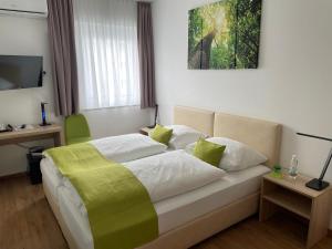 Postel nebo postele na pokoji v ubytování Hotel Garni Ilys Inn