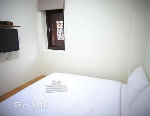 Postel nebo postele na pokoji v ubytování 沐光獨棟館