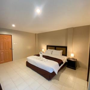 Postel nebo postele na pokoji v ubytování Du-sila Hotel kohchang