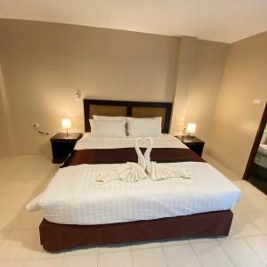 Postel nebo postele na pokoji v ubytování Du-sila Hotel kohchang