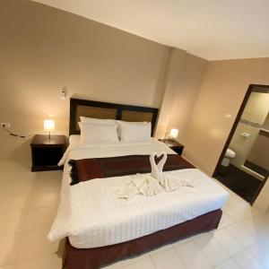 Postel nebo postele na pokoji v ubytování Du-sila Hotel kohchang