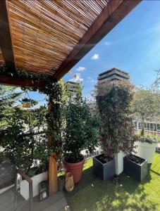 A garden outside Giresio 41 - Your Penthouse with Rooftop Garden in Milano Navigli - WIFI