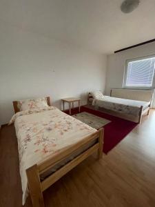 Ένα ή περισσότερα κρεβάτια σε δωμάτιο στο Apartment Rea Ilidža