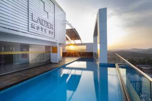 a swimming pool on the roof of a building at THE TERRACE MANJERI in Manjeri