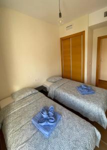 En eller flere senge i et værelse på Cómodo apartamento en Archena