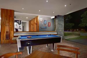 a billiard room with a pool table in it at ASTON Anyer Beach Hotel in Anyer