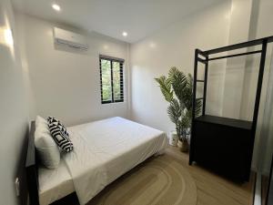 Ein Bett oder Betten in einem Zimmer der Unterkunft ANH’s HOUSE