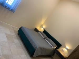 Postel nebo postele na pokoji v ubytování B&B Mercadante