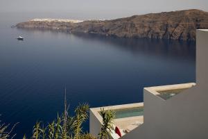 a view of a body of water from a house at Atoles Retreat in Imerovigli