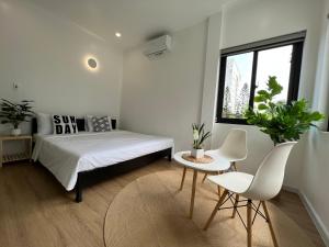 Ein Bett oder Betten in einem Zimmer der Unterkunft ANH’s HOUSE