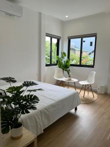 Ein Bett oder Betten in einem Zimmer der Unterkunft ANH’s HOUSE