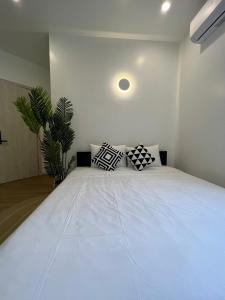 Ein Bett oder Betten in einem Zimmer der Unterkunft ANH’s HOUSE