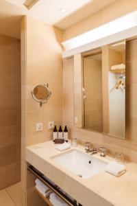 a bathroom with a sink and a mirror at Townhouse Dresden in Dresden +26 photos