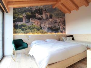 a bedroom with a large bed and a wall mural at Chalet in Veneto near Dolomites Ski Slopes in Volpago del Montello