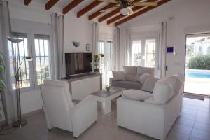 Posedenie v ubytovaní Casa Josi con vistas panorámicas en Monte Pego